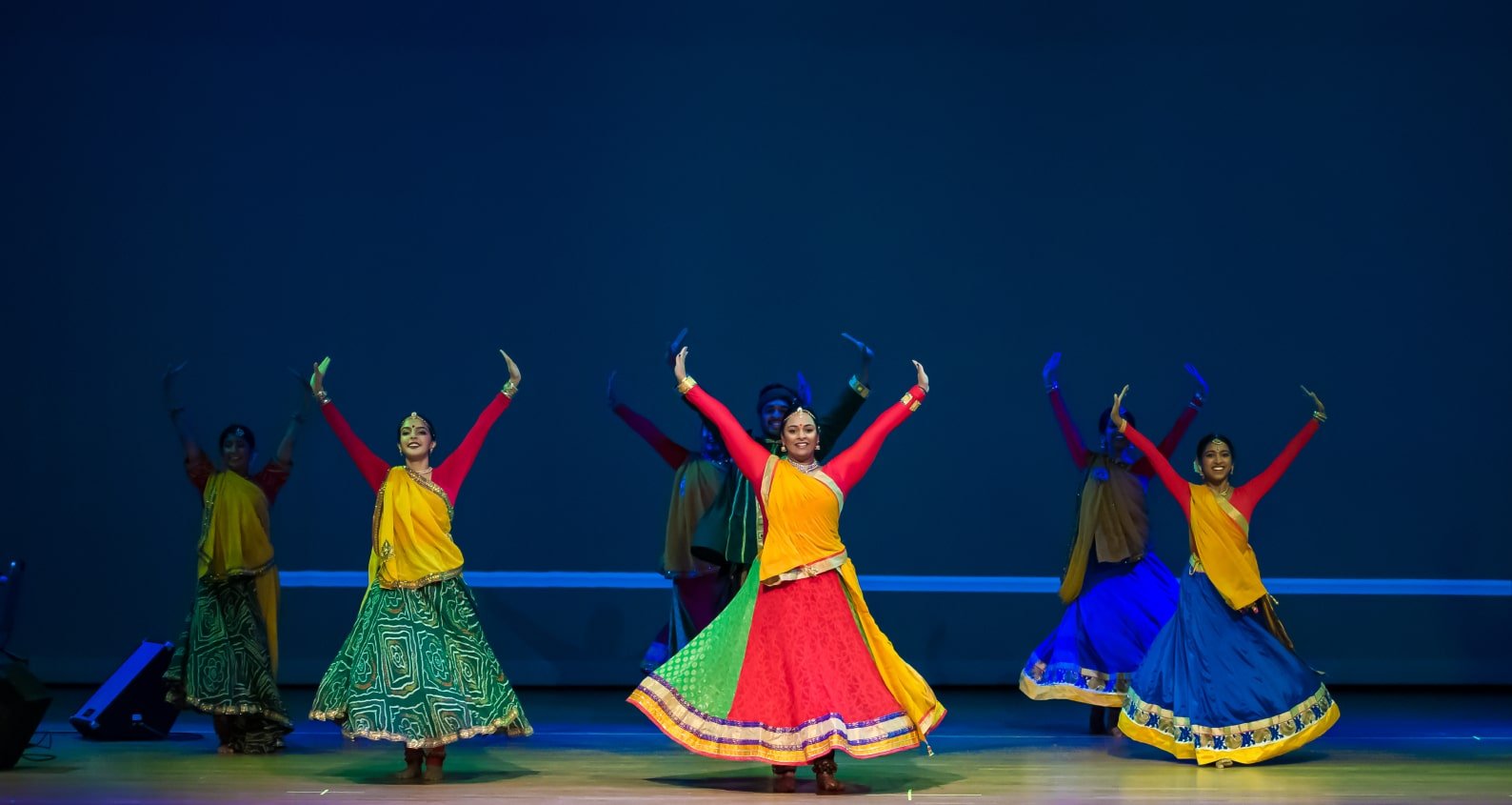 Dancers performing on stage.