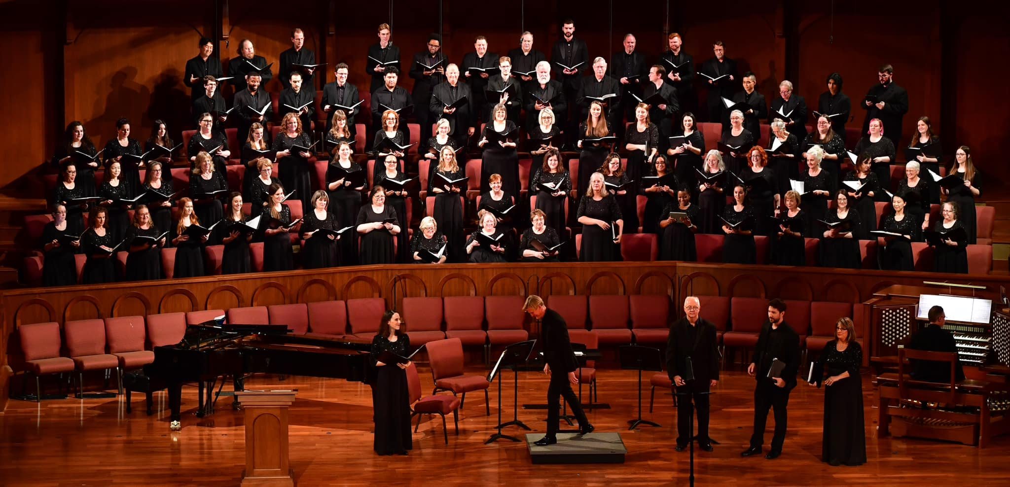 The chorus in performance in a theater.